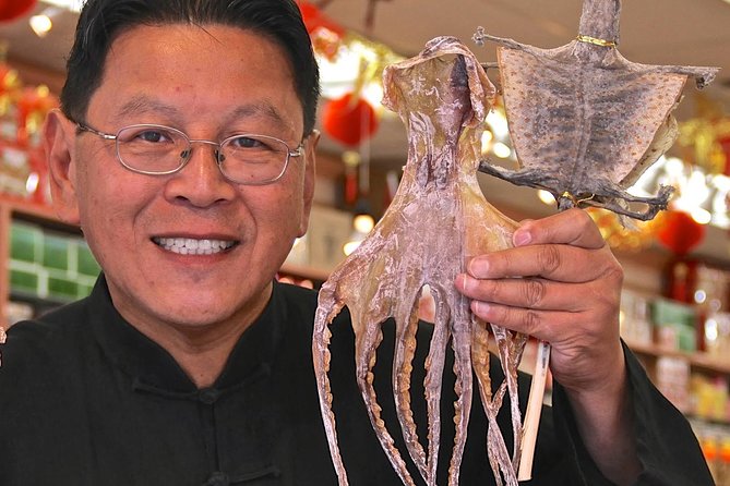 A Wok Around Chinatown: Culinary and Cultural Walking Tour Led by a Chef - Walking through Chinatown with food in the story