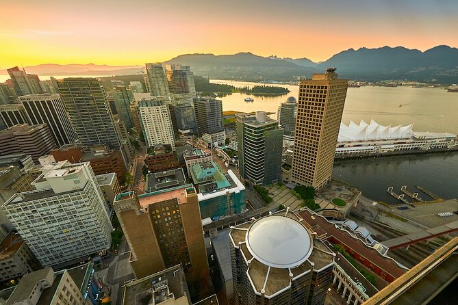 Vancouver Small Group Night Tour w/Capilano + Grouse Mtn Dinner - Riding Grouse Mountain’s Skyride at twilight