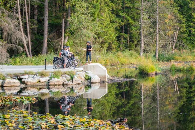 Vancouver: Stanley Park Bicycle Tour - Entering Stanley Park through rainforest and waterfront paths