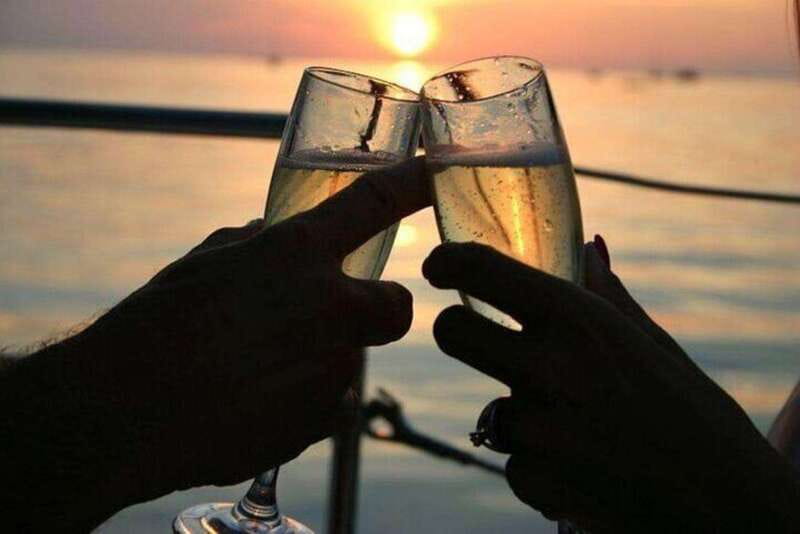 Vancouver: Sunset Boat Cruise with Complementary Bubbly - Raising a glass at sea